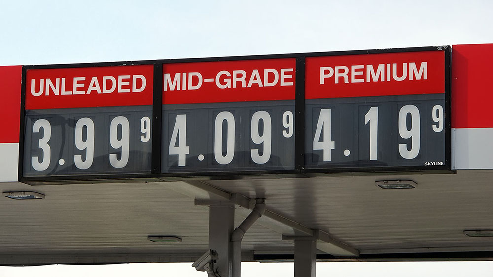 A sign at a gas station shows the following prices: $3.99 for Unleaded; 4.09 for mid-grade; and 4.19 for Premium.
