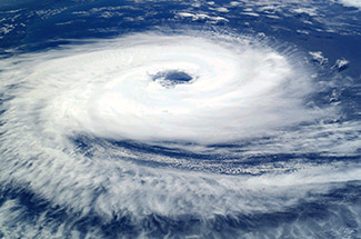 A photgraph of a hurricane, showing the rotation around its eye.