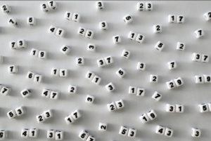 Prime numbers written with dice including 5, 41, 19, 61, and many others