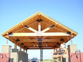 A wooden truss holding up a roof.